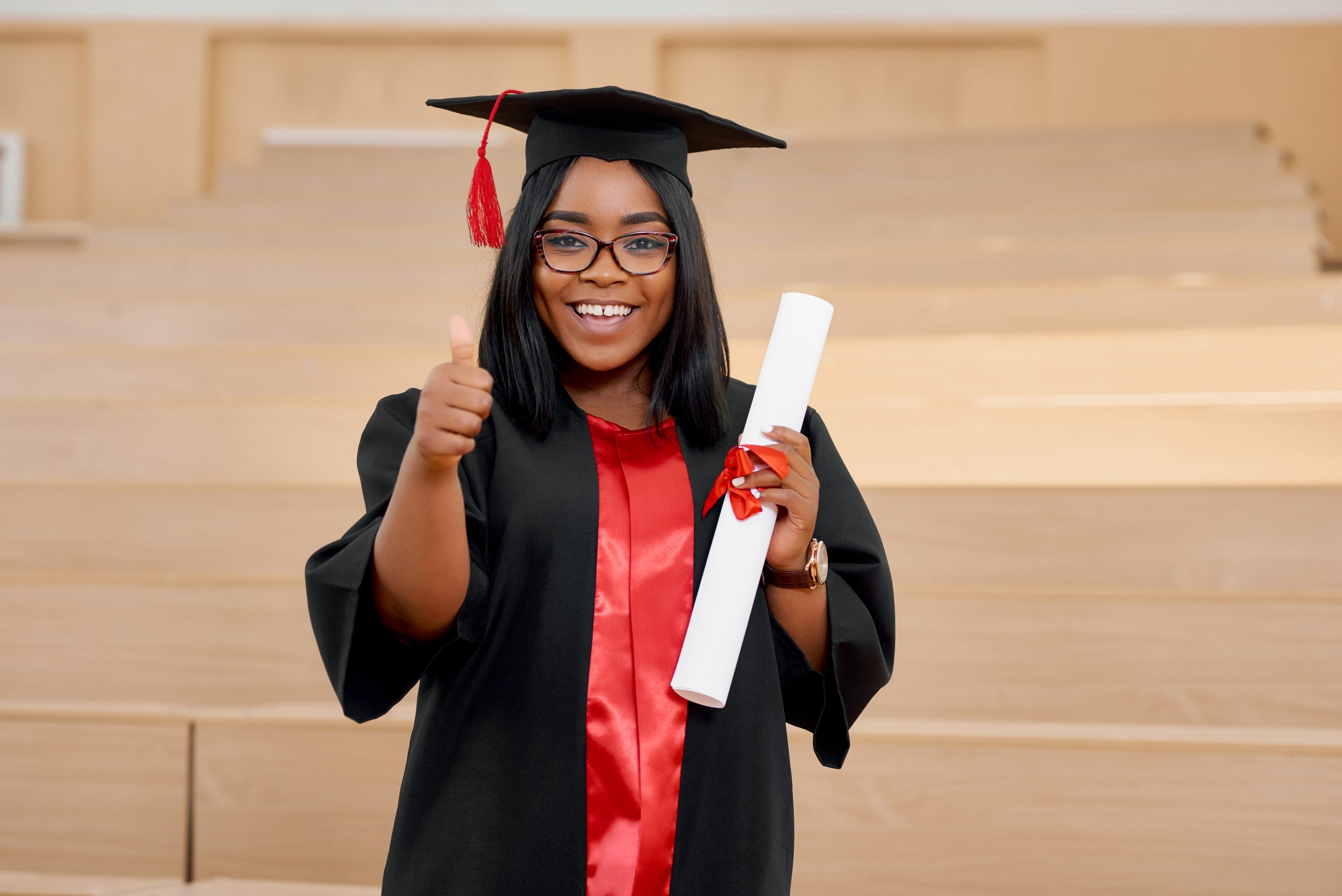 Positive girl graduating from university.