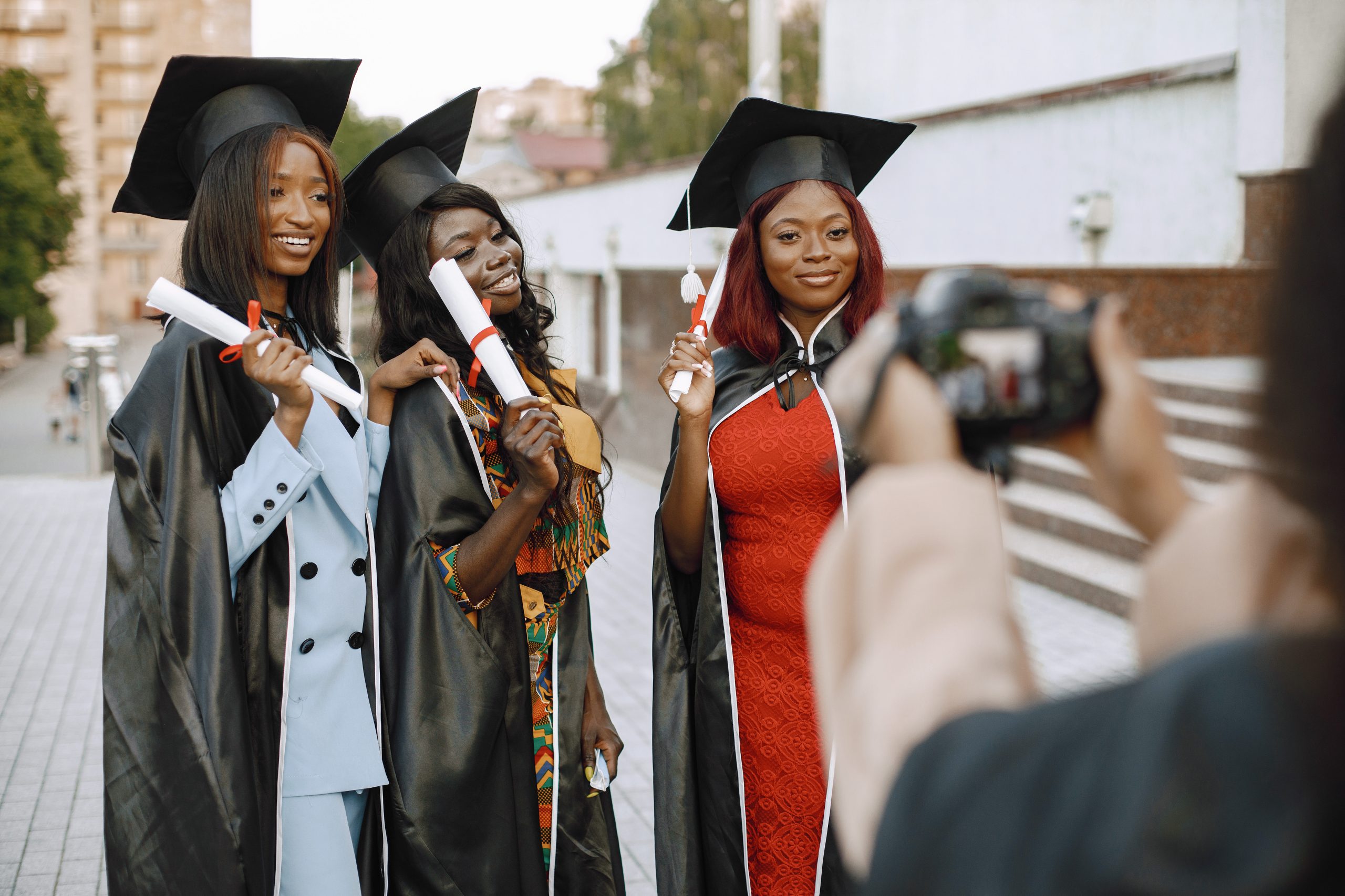 Three african american female students posing for a photo at the
