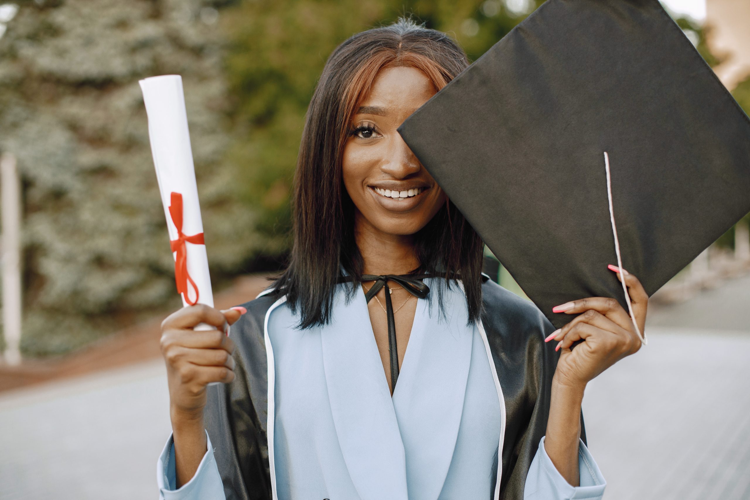 Excited african american woman at her graduation.