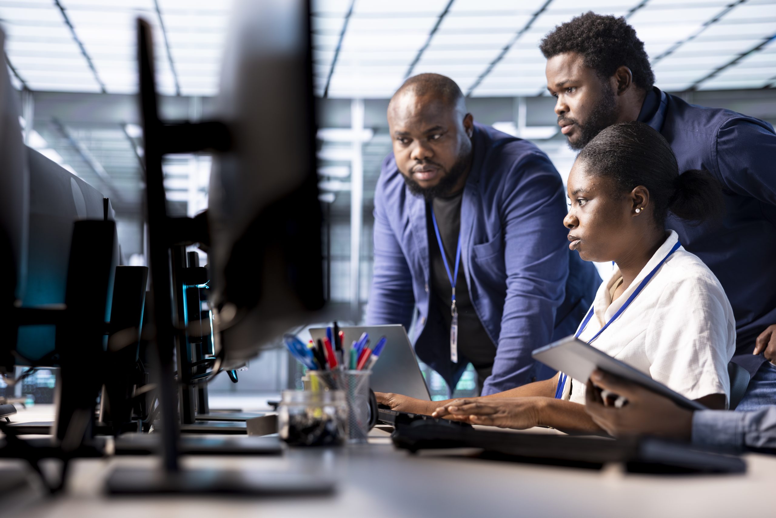 Server hub IT staff members debugging and optimizing code